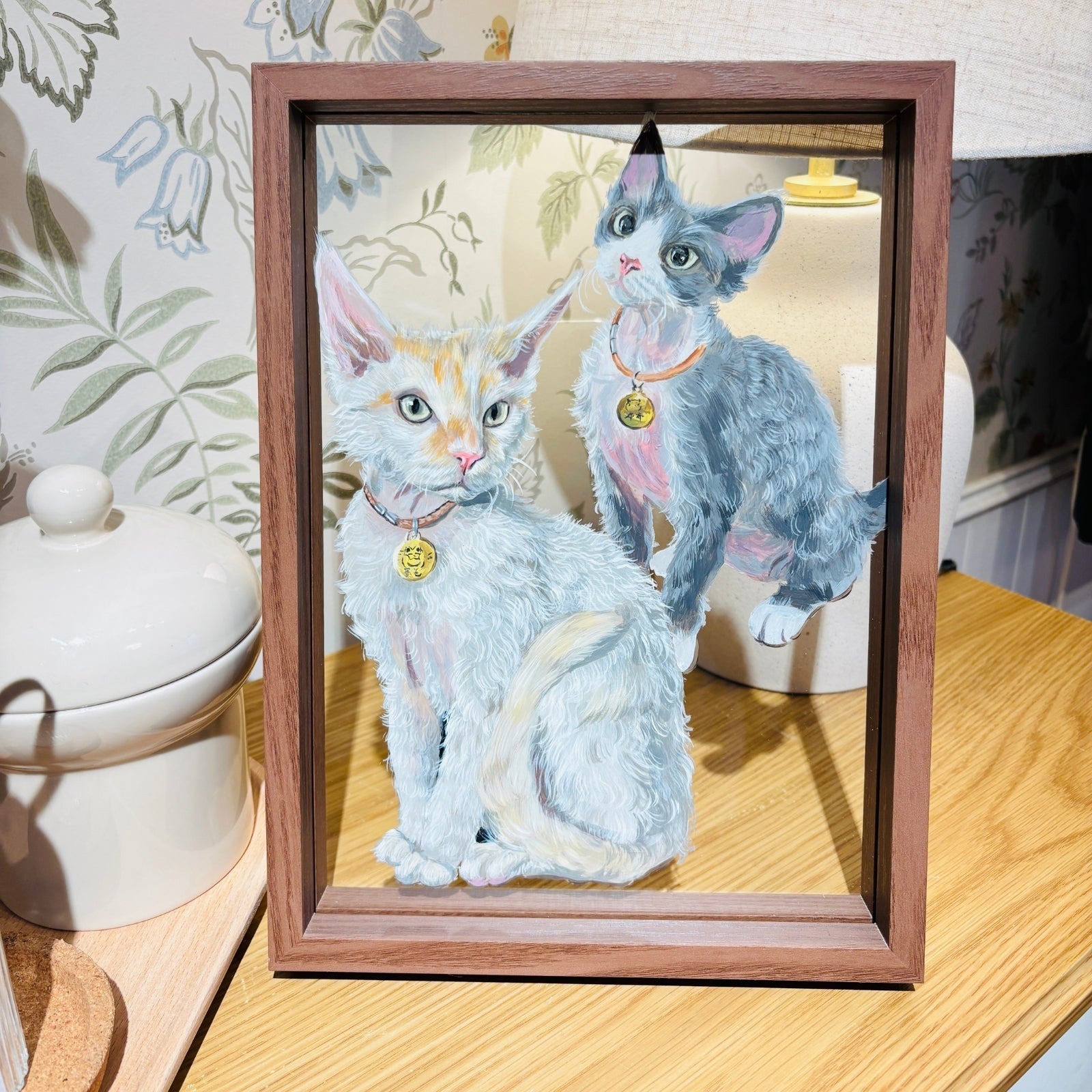 Finished custom dog portrait displayed in glass sandwich frame